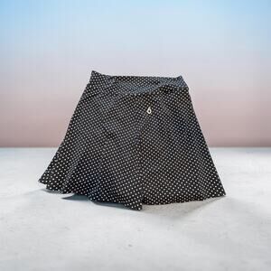 Dona Jo  running. Skort.  Black with white polka dots